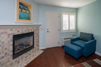 Morro Shores Inn Guest Rooms - Fireplace in a coastal decorater room