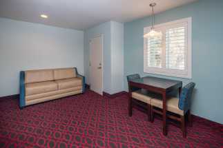 Morro Shores Inn Guest Rooms - Sleeper Sofa and Dining Table
