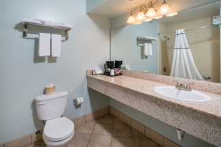 Morro Shores Inn Guest Rooms - Granite vanity and full private bathroom