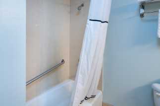Morro Shores Inn Guest Rooms - Bathrooms feature full bath shower tubs